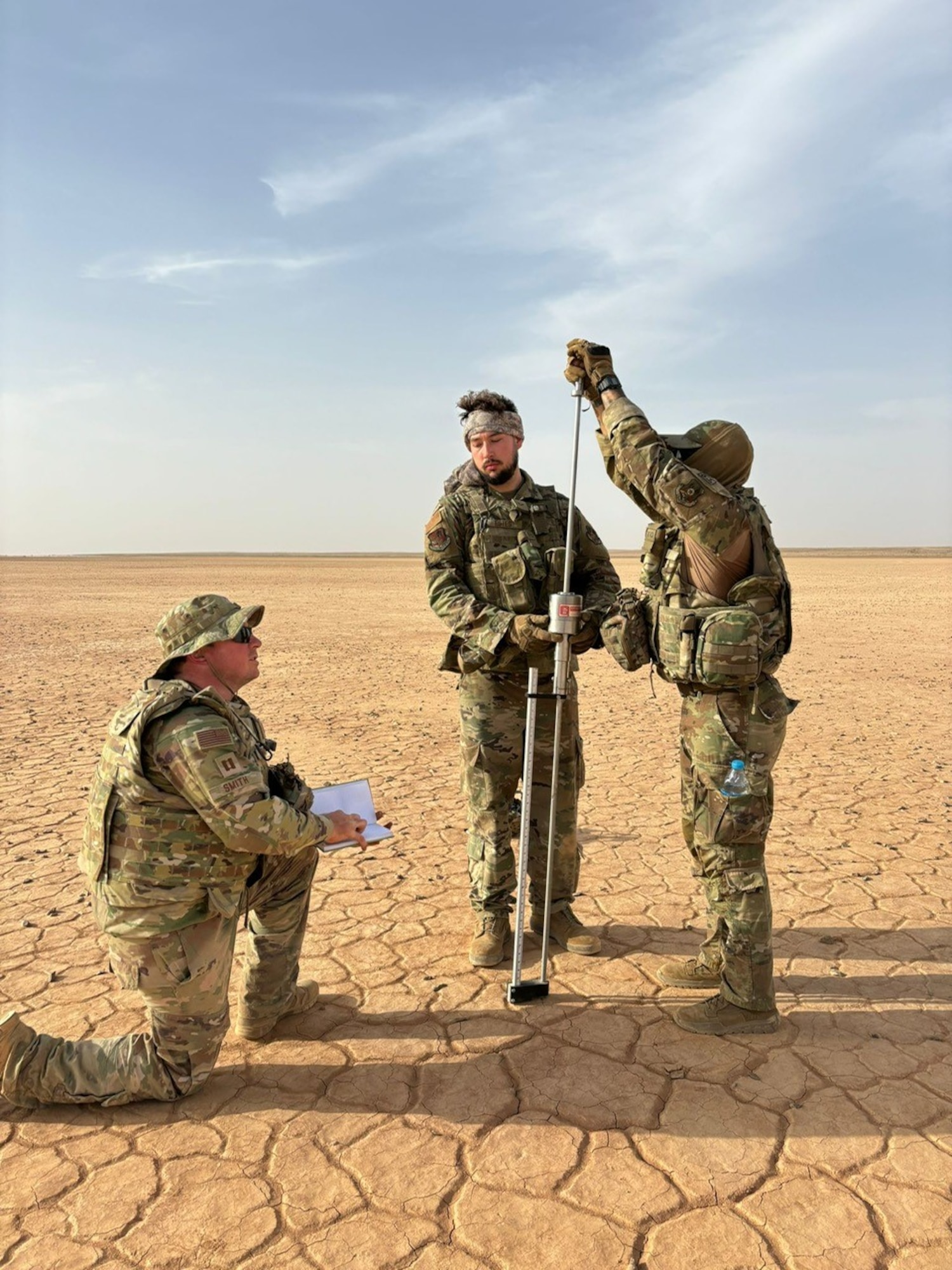 Airmen assigned to the 1st Expeditionary Theater Support Group evaluate a site for a contingency airfield at an undisclosed location within the U.S. Central Command area of responsibility, May 20, 2024. The purpose of the evaluation is to test the soil strength for airfield operations. (U.S. Air Force Courtesy photo)