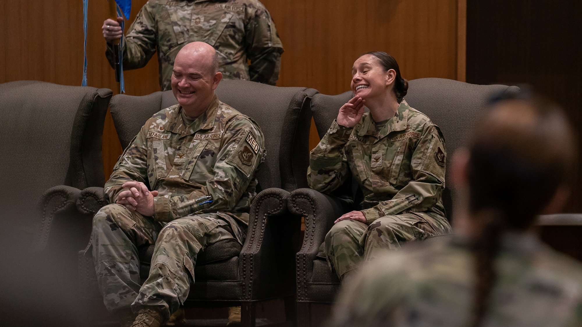 outgoing and inbound 18th medical group comander share a laugh together