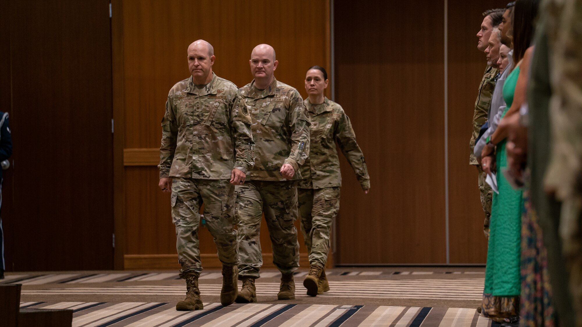 kadena air base commander, outgoing 18th medical group commander and incoming 18th medical group commander enter the room