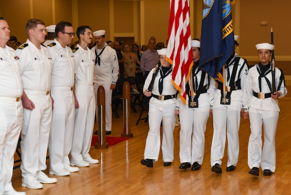 Naval Medical Center Camp Lejeune Honor Guard parades the colors during the Camp Lejeune Family Medicine Residency Program graduation at Marston Pavilion, on June 28, 2024. The ceremony celebrated the graduation of 10 residents, 10 interns, and two sports medicine fellows who will go on to their next duty stations around the world to continue practicing medicine.