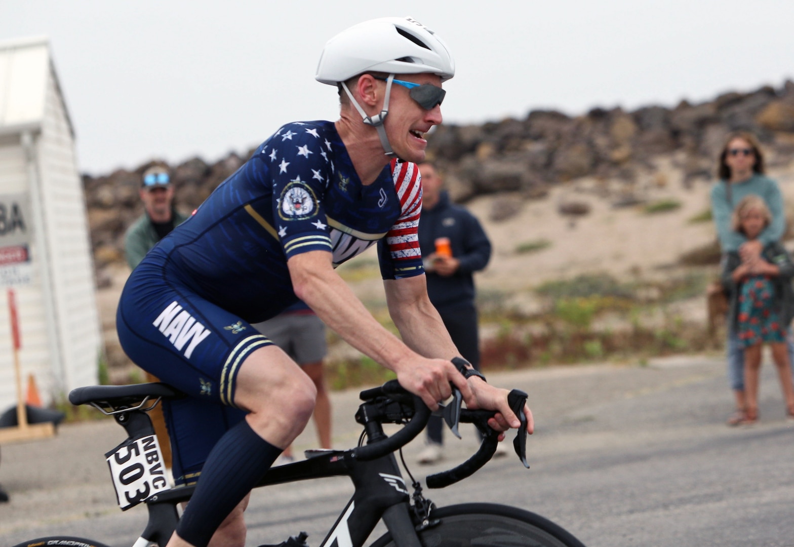 Navy Lt. Cmdr. Kyle Hooker of the Pentagon rides to his seventh gold medal during the 2024 Armed Forces Triathlon Championships was held at Naval Base Ventura County, Calif., June 26-30. Service members from Army, Marine Corps, Navy (with Coast Guard) and Air Force (with Space Force) battled alongside the Canadian forces for gold. (U.S. Army photo by Master Sgt. Sharilyn Wells/USACAPOC(A) PAO)