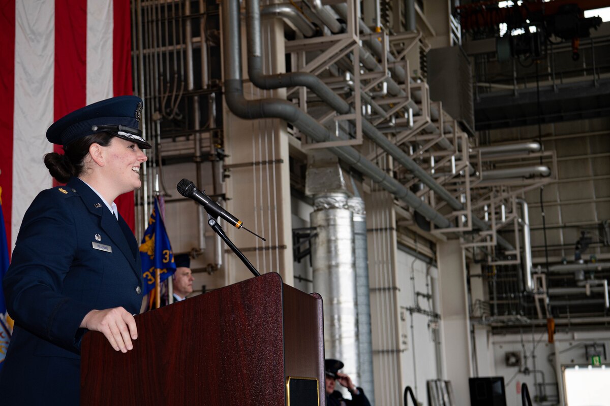 Airman gives speech at podium.