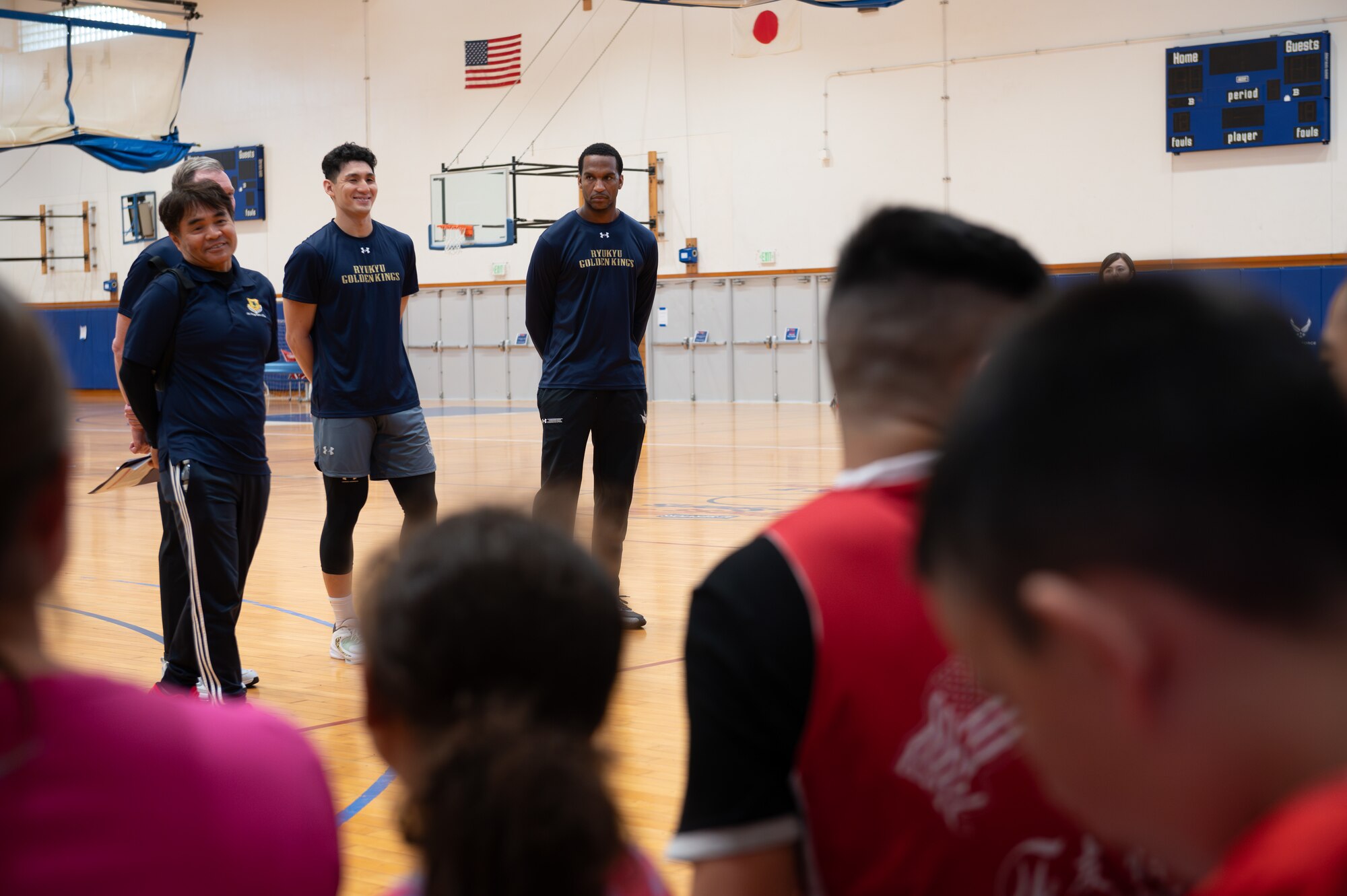 Ryukyu Golden Kings team members participate in a question and answer session during a bilateral basketball camp