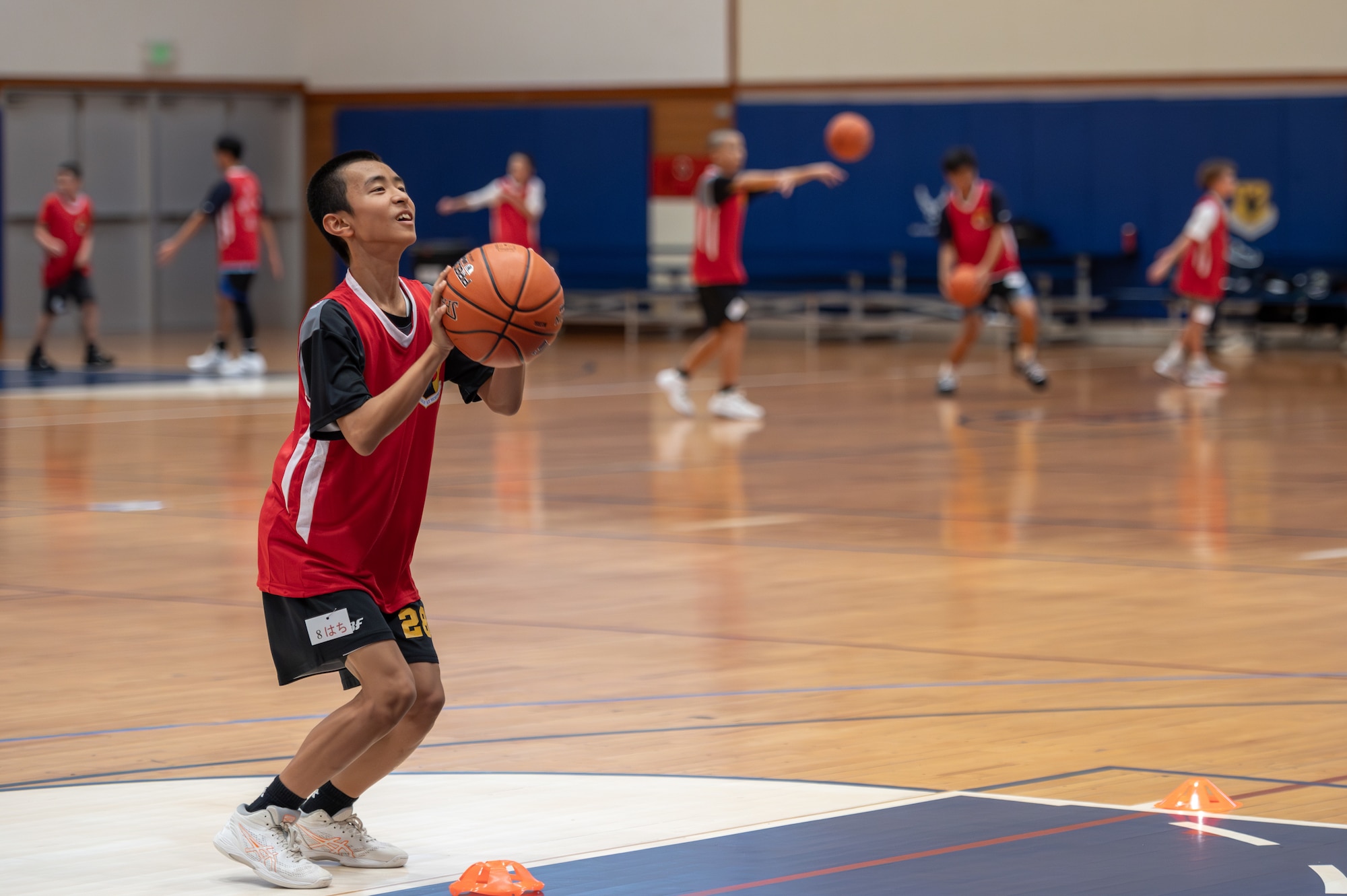 student prepares to throw a basketball