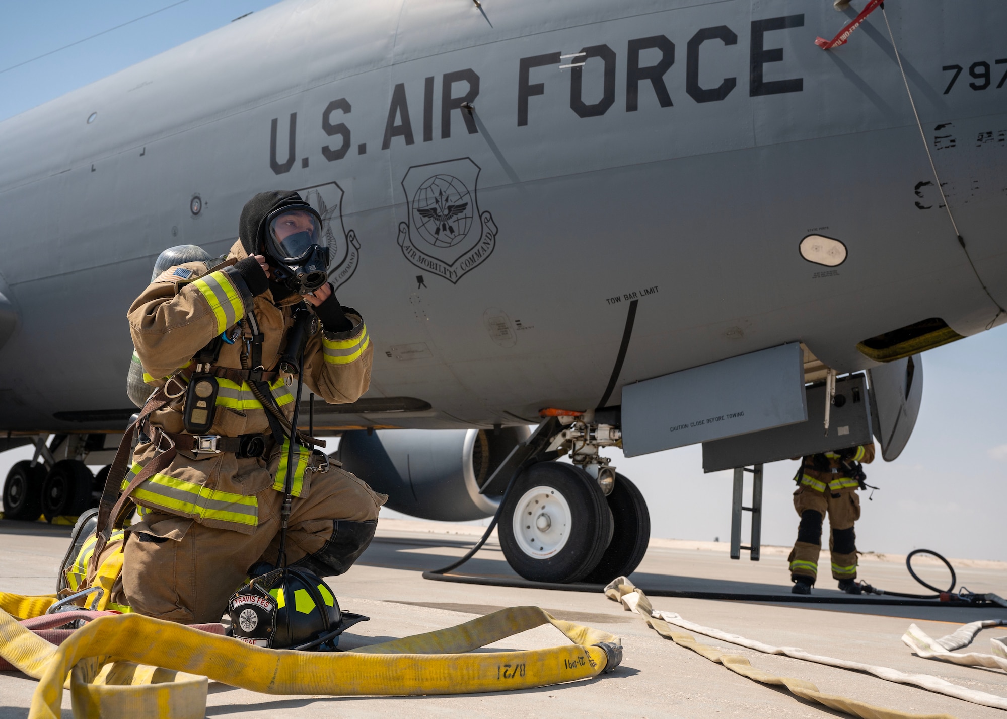 U.S. Air Force firefighter dawns on equipment during an aircraft mishap exercise at an undisclosed location in the U.S. Central Command area of responsibility, Feb. 29, 2024. Aircraft mishap exercises are vital for ensuring the Air Force's readiness, continuous improvement, and ability to mitigate risks, fostering coordination, community safety, and mission assurance in the face of potential emergencies. (U.S. Air Force Courtesy Photo)