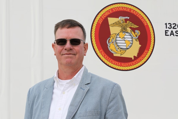Mr. Keith L. Pruski, Marine Force Reserve (MFR) liaison, to 2d Force Storage Battalion (FSB), Marine Force Storage Command, stands in front of the tension shelters managed by 2d FSB while visiting the FSB headquarters in Albany, Ga. Pruski has been named the Marine Corps Civilian Logistician of the year for 2024.