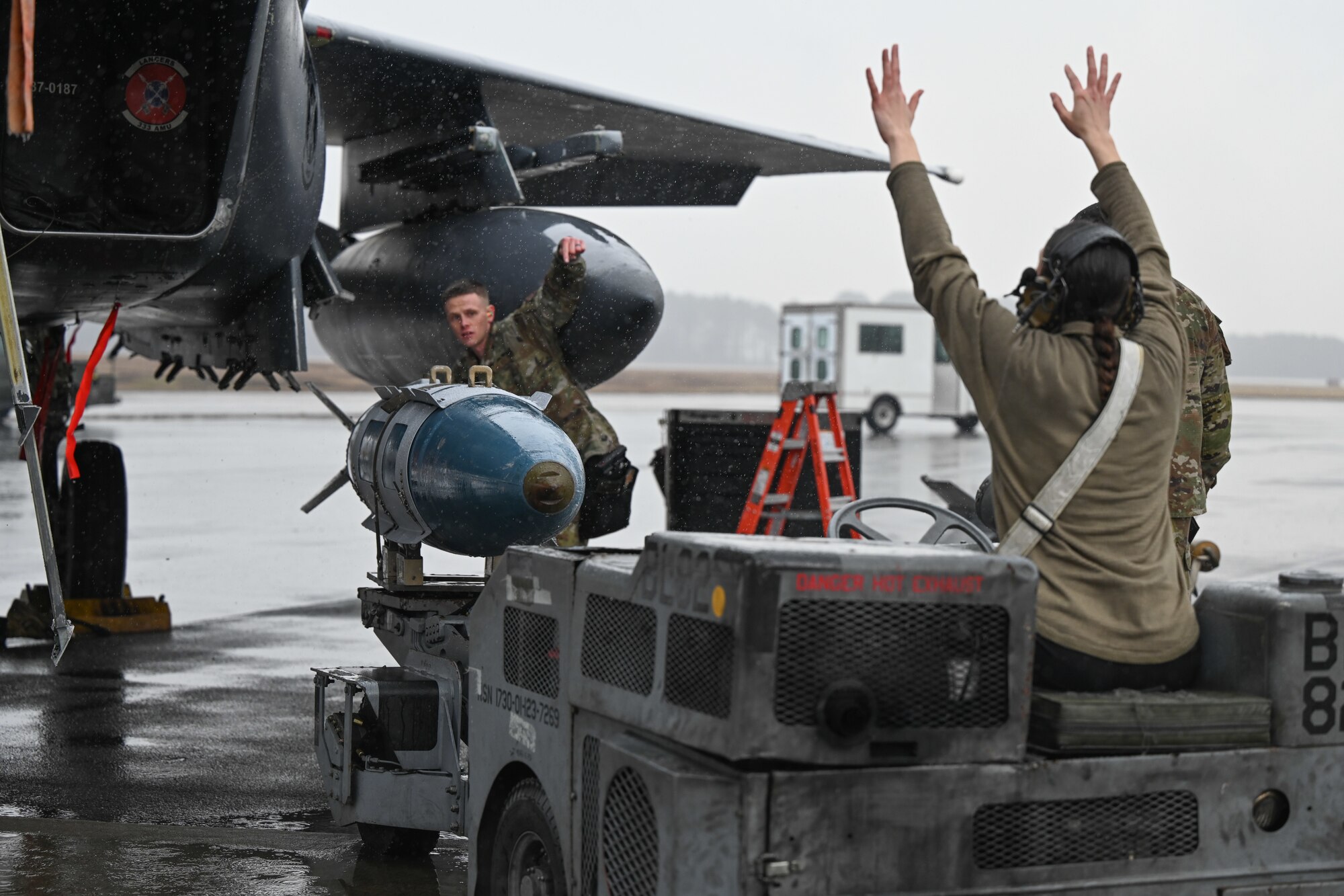 U.S. Air Force Airman 1st Class Kyle Stowers, left, a weapons load crew member assigned to the 333rd Fighter Generation Squadron, load munitions on an F-15E Strike Eagle during an annual load crew competition at Seymour Johnson Air Force Base, North Carolina, on February 23, 2024. The teams consisted of Airmen assigned to the 333rd, 334th, 335th, and 336th Fighter Generations Squadrons, as well as the 414th Fighter Group. (U.S. Air Force photo by Staff Sgt. Koby I. Saunders)