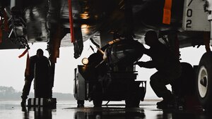 U.S. Airmen assigned to the 334th Fighter Generation Squadron load munitions on an F-15E Strike Eagle during an annual load crew competition at Seymour Johnson Air Force Base, North Carolina, on February 23, 2024. The teams consisted of Airmen assigned to the 333rd, 334th, 335th and 336th Fighter Generations Squadrons, as well as the 414th Fighter Group. (U.S. Air Force photo by Staff Sgt. Koby I. Saunders)