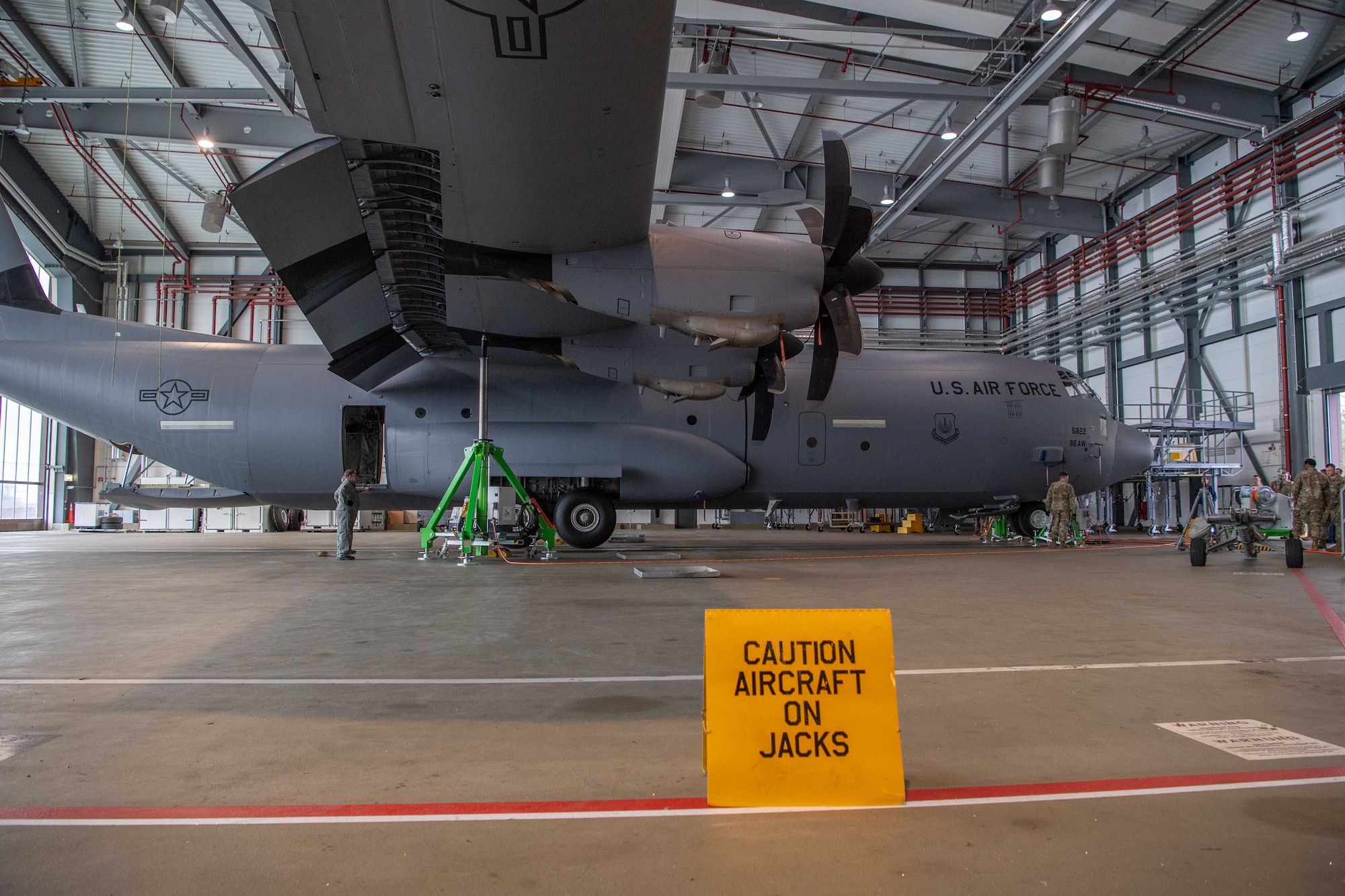 C-130J Super Hercules is lifted into the air by four electric jacks