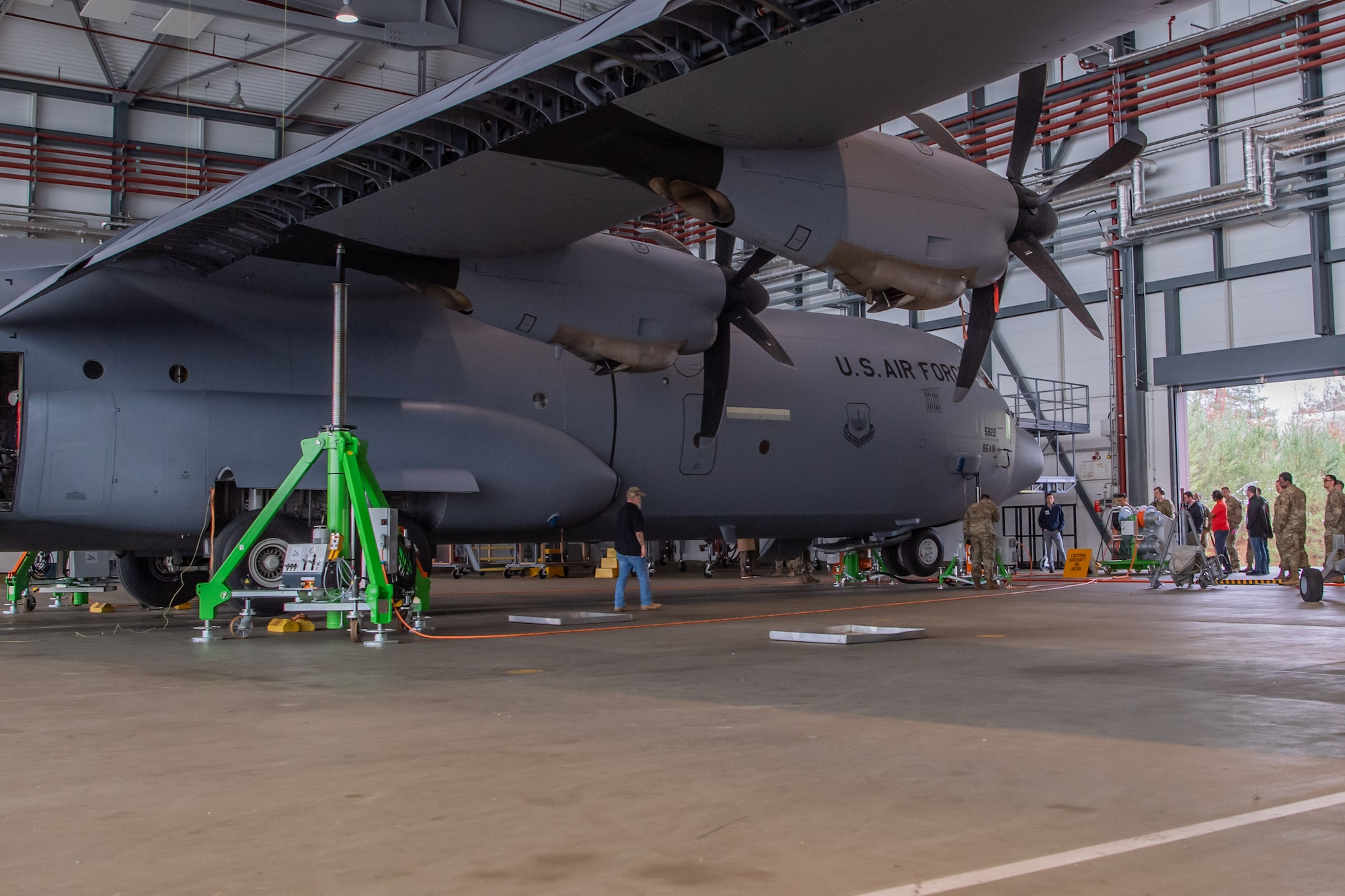 Airmen jack a C-130J Super Hercules into the air
