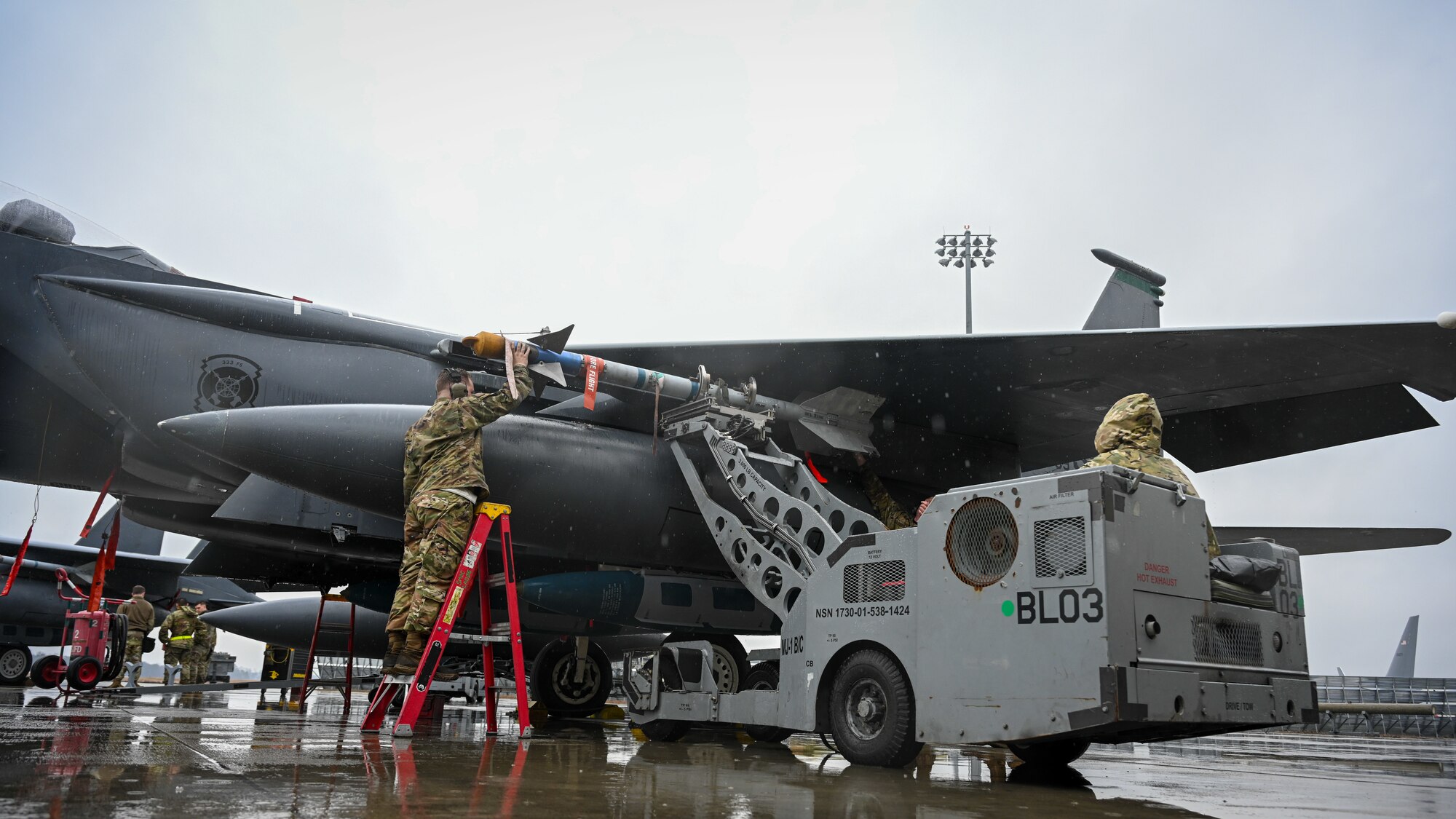 U.S. Airmen assigned to the 335th Fighter Generation Squadron participate in an annual load crew competition at Seymour Johnson Air Force Base, North Carolina, on February 23, 2024. The teams consisted of Airmen assigned to the 333rd, 334th, 335th and 336th Fighter Generations Squadrons, as well as the 414th Fighter Group. (U.S. Air Force photo by Staff Sgt. Koby I. Saunders)
