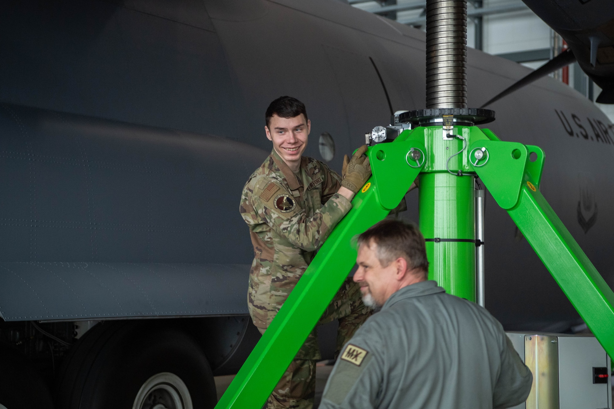 Airmen inspect electric jack