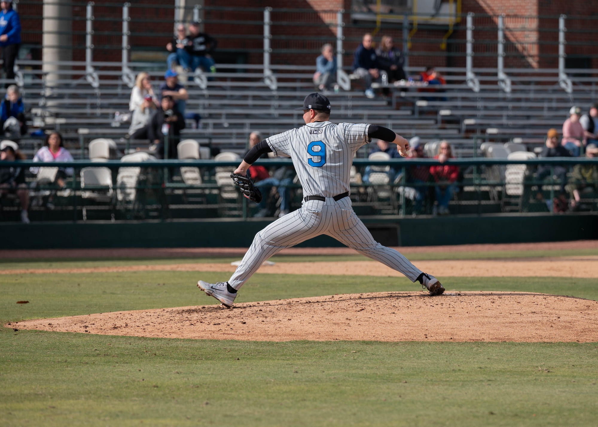Dylan Rogers of the U.S. Air Force Academy baseball team pitches to the Naval Academy  during the 14th Annual Freedom Classic baseball series at Grainger Stadium in Kinston, North Carolina, Feb. 24, 2024. The Naval Academy lost 4 - 3 to the Air Force Academy. (U.S. Air Force photo by Airman 1st Class Rebecca Sirimarco-Lang)