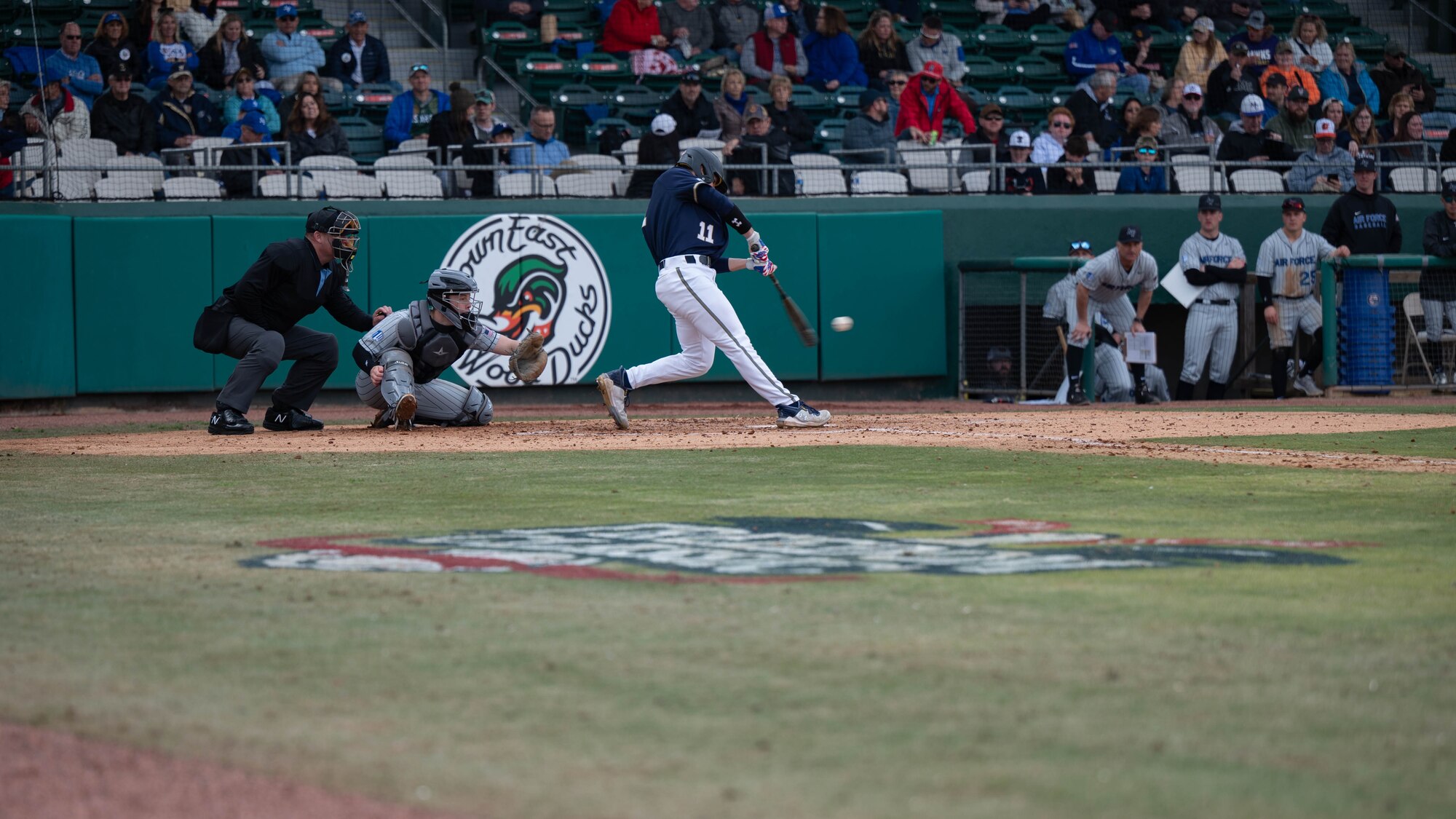 Naval Academy cadet Anthony Fiallo, hits a baseball during the 14th Annual Freedom Classic baseball series at Grainger Stadium in Kinston, North Carolina, Feb. 24, 2024. The Naval Academy lost 4 - 3 to the Air Force Academy. (U.S. Air Force photo by Airman 1st Class Rebecca Sirimarco-Lang)