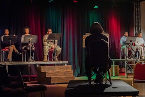 Kaiserslautern Military Community OnStage actors rehearse their lines for an upcoming staged reading performance