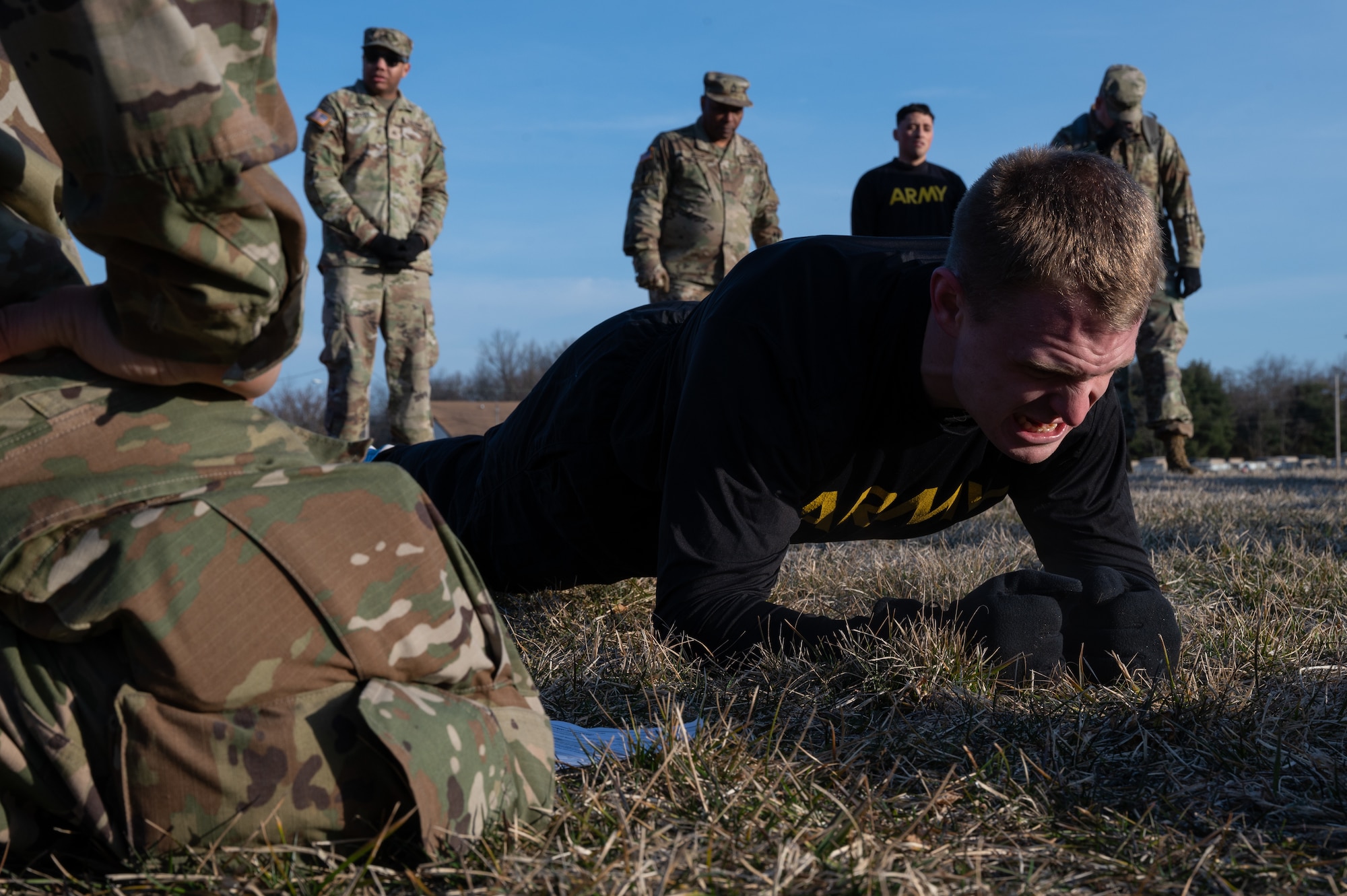 U.S. Army Staff Sgt. Timothy Sullivan, Detachment 3, 2300 Military Intelligence Group, National Intelligence Support Group, Military Intelligence Readiness Command intelligence analyst, performs a plank during the Best Warrior Competition at Joint Base McGuire-Dix-Lakehurst, N.J., Feb. 22, 2024. Participants underwent rigorous evaluations by seasoned leaders who are subject matter experts in their respective fields. The assessments encompassed a wide range of military skills tests, including physical fitness, weapons knowledge, marksmanship, land navigation, general military knowledge and more. (U.S. Air Force photo by Airman 1st Class Aidan Thompson)