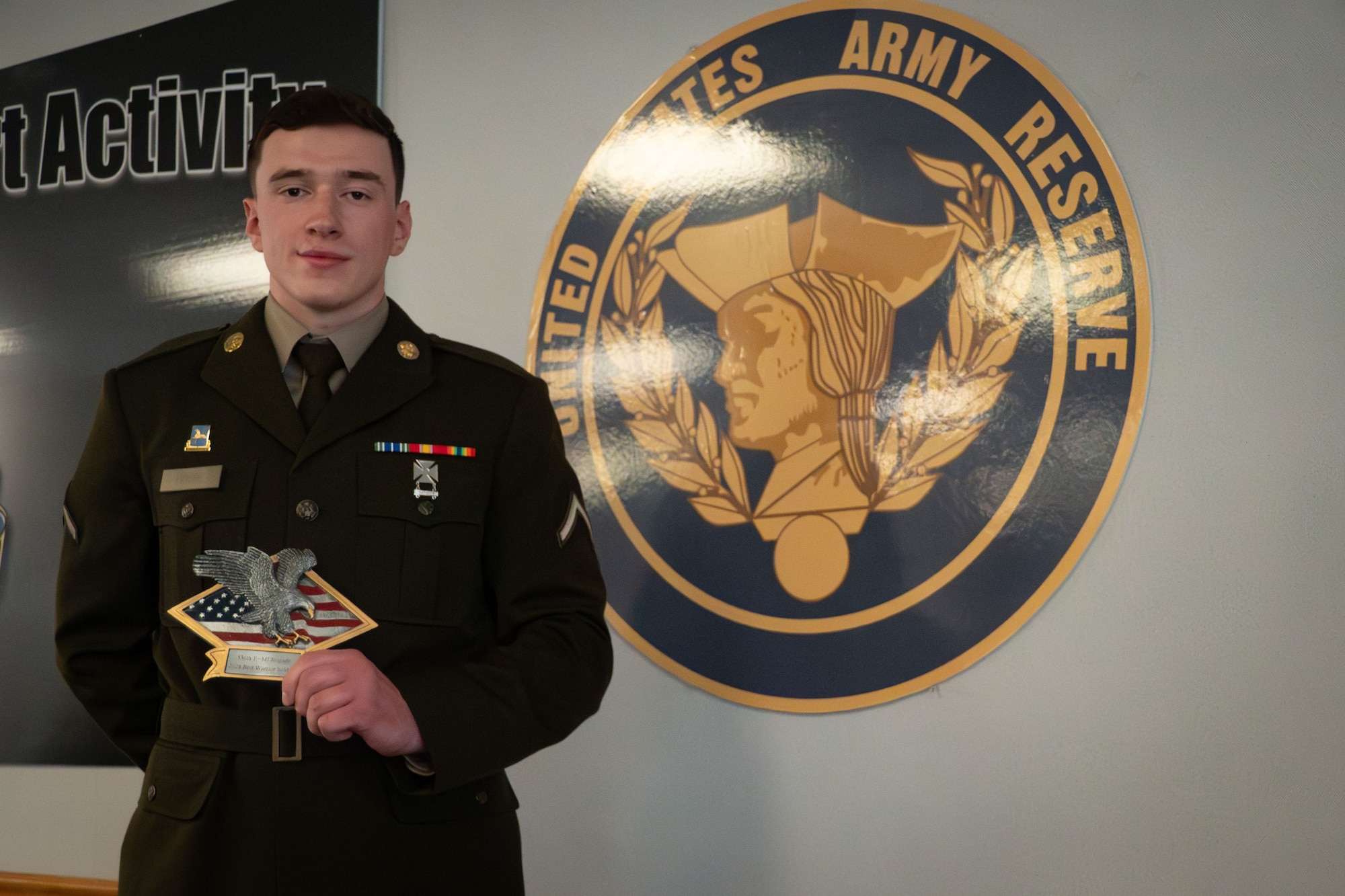 U.S. Army Pfc. Alex House, Alpha Company, 325th Expeditionary Military Intelligence Battalion, 336th Expeditionary Military Intelligence Brigade, Military Intelligence Readiness Command intelligence analyst, holds his award for the 336th EMIB’s 2024 Best Warrior Soldier during the Best Warrior Competition awards ceremony at Joint Base McGuire-Dix-Lakehurst, N.J., Feb. 22, 2024. Participants underwent rigorous evaluations by seasoned leaders who are subject matter experts in their respective fields. The assessments encompassed a wide range of military skills tests, including physical fitness, weapons knowledge, marksmanship, land navigation, general military knowledge and more. (U.S. Air Force photo by 2nd Lt. Alexis Kula)
