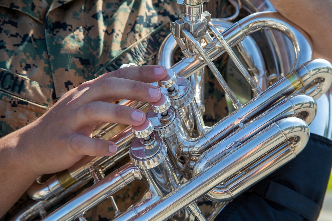 U.S. Marine Corps Sgt. William Emrich, a musician with the 2nd Marine Aircraft Wing (MAW) Brass Band, plays the tuba during the 2nd MAW Brass Band drive-thru concert at Grants Landing Community Center, Marine Corps Air Station Cherry Point North Carolina, April 27, 2022. Throughout the performance, sweet treats, goody bags, and resources for military families were handed out in honor of Month of the Military Child. (U.S. Marine Corps photo by Lance Cpl. Lauralle Walker)