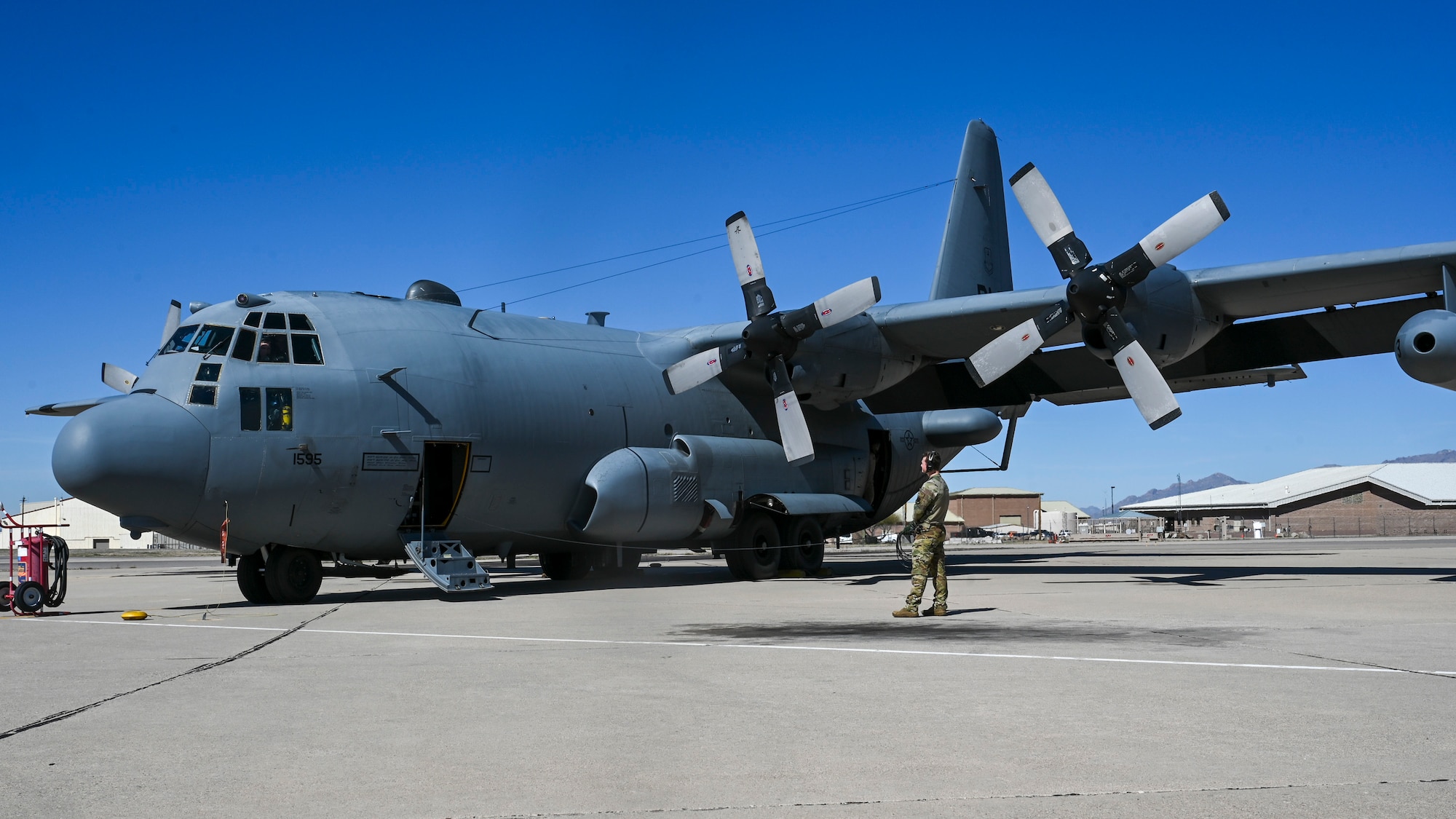 Airmen communicating with aircrew for departure.