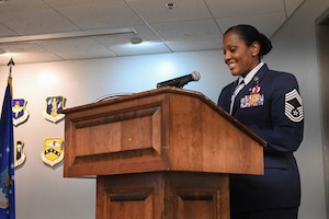 A woman in uniform gives a speech.
