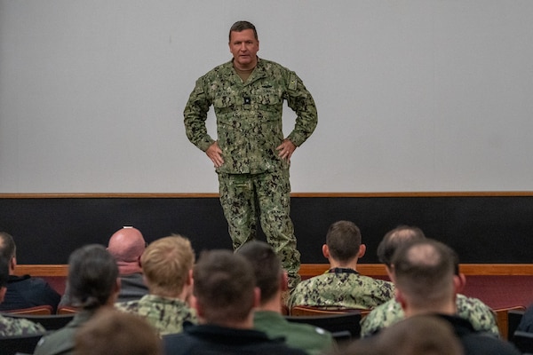 Rear Adm. Martin Muckian, commander, Submarine Group TWO, delivers closing remarks during the Theater Undersea Warfare symposium held at the Choplinsky Auditorium at Naval Support Activity Hampton Roads, Feb. 29, 2024.