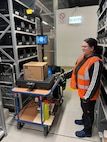Jeanette Hoeh, a supply technician at the U.S. Army Medical Materiel Center-Europe, scans a box of medical supplies using a new scale system being piloted to streamline warehousing and distribution operations. The new “dimensioner” system incorporates a high-tech scale with optical features that can capture images and calculate the exact dimensions and weight of items being inventoried or readied for shipment.