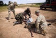 Military members from the Kenya Defence Forces and U.S. Army Soldiers from the 921st Field Hospital, 176th Medical Brigade, 807th Medical Command, a U.S. Army Reserve unit, splint a casualty’s arm during a medical evacuation rehearsal during Justified Accord 2024 (JA24) at the Counter Insurgency Terrorism and Stability Operations Training Centre in Nanyuki, Kenya Feb. 27, 2024. JA24 is U.S. Africa Command's largest exercise in East Africa, running from Feb. 26 - March 7. Led by U.S. Army Southern European Task Force, Africa (SETAF-AF), and hosted in Kenya, this year's exercise will incorporate personnel and units from 23 nations. This multinational exercise builds readiness for the U.S. joint force, prepares regional partners for UN and AU mandated missions, and increases multinational interoperability in support of humanitarian assistance, disaster response and crisis response. (U.S. Army photo by Sgt. 1st Class Leron Richards)