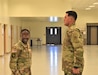 1st Lt. Kiera Butler, commander, Headquarters and Headquarters Detachment, 418th Quartermaster Battalion, 653rd Regional Support Group, prepares to administer a promotion ceremony for Staff Sgt. Ricardo Bojorquez, Feb. 24, Silverbell Armed Forces Readiness Center, Red Rock, Ariz. (U.S. Army Reserve Photo by Maj. Alun Thomas, 653rd Regional Support Group Public Affairs)