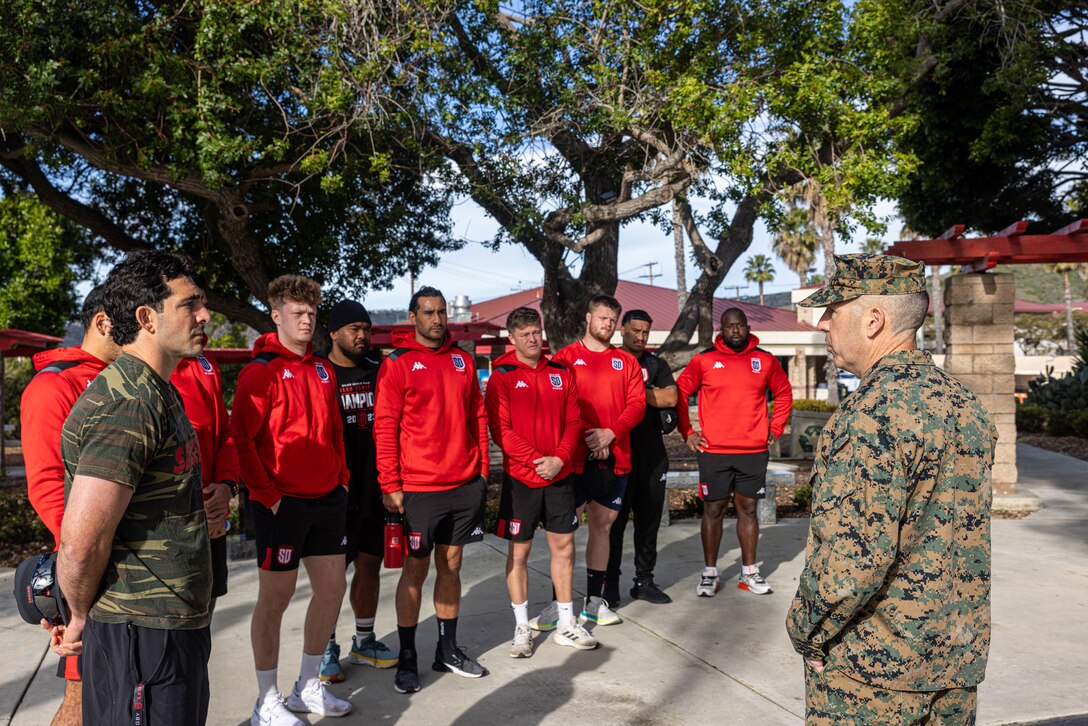 U.S. Marine Corps Col. Brian Mulvihill, right, the commanding officer of Marine Rotational Force – Darwin 24.3, speaks with members of the San Diego Legion rugby team before a rugby clinic at Marine Corps Base Camp Pendleton, California, Feb. 23, 2024. SD Legion was brought in to teach MRF-D 24.3 Marines about rugby, a sport that builds comradery and teamwork. Founded in 2017, the SD Legion is a San Diego based rugby union team with players from all over the world. Mulvihill is a native of New York state. (U.S. Marine Corps photo by Cpl. Juan Torres)
