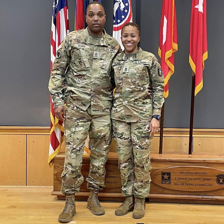 photo of women wearing U.S. Army uniform with a man wearing uniforms.