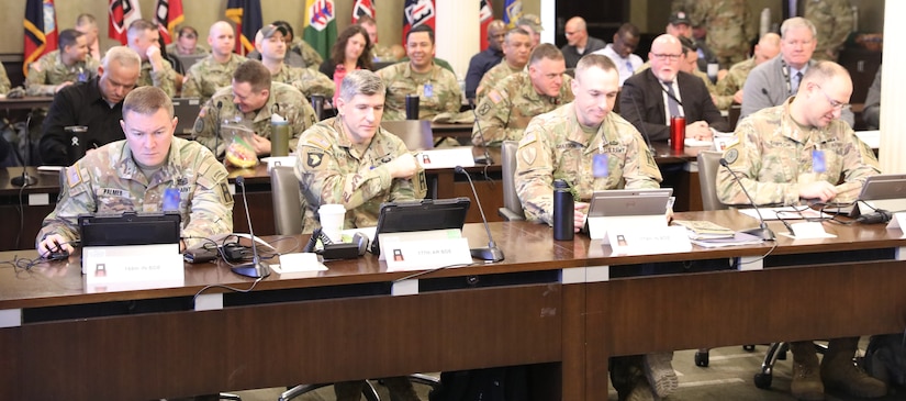 Attendees at the First Army Training Support and Synchronization Working Group prepare to kick off their week in the Pershing Conference Room of First Army headquarters on Rock Island Arsenal, Illinois.