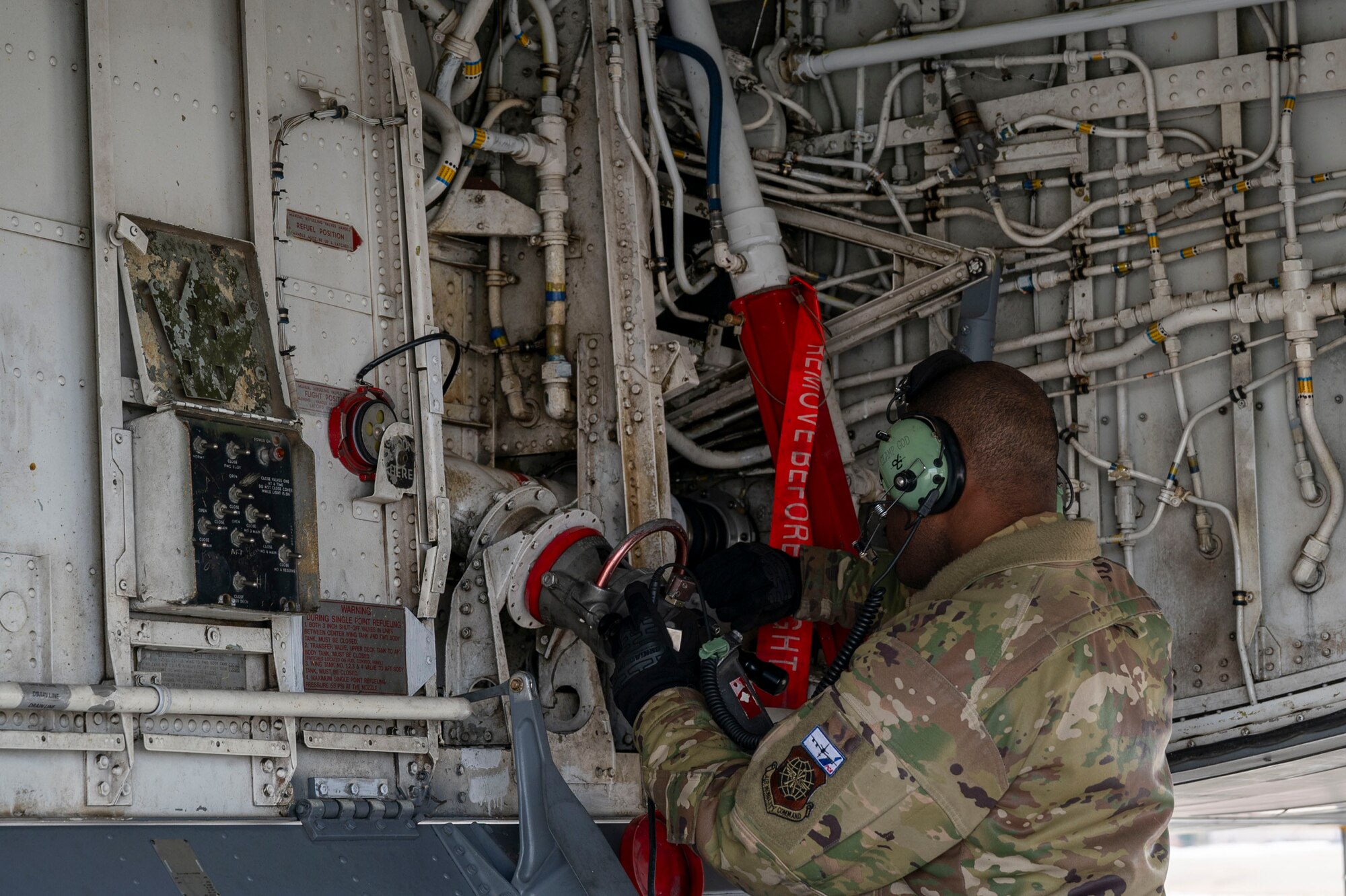 Tech. Sgt. Rod Harris, 22nd Aircraft Maintenance Squadron crew chief, conducts a wet wing defuel on a KC-135 Stratotanker during EXPLODEO Feb. 26, 2024, at Grand Forks Air Force Base, North Dakota. EXPLODEO was a McConnell Air Force Base, Kansas, exercise that tested the 22nd and 931st Air Refueling Wings’ ability to rapidly deploy and employ into a theater. (U.S. Air Force photo by Airman 1st Class Gavin Hameed)