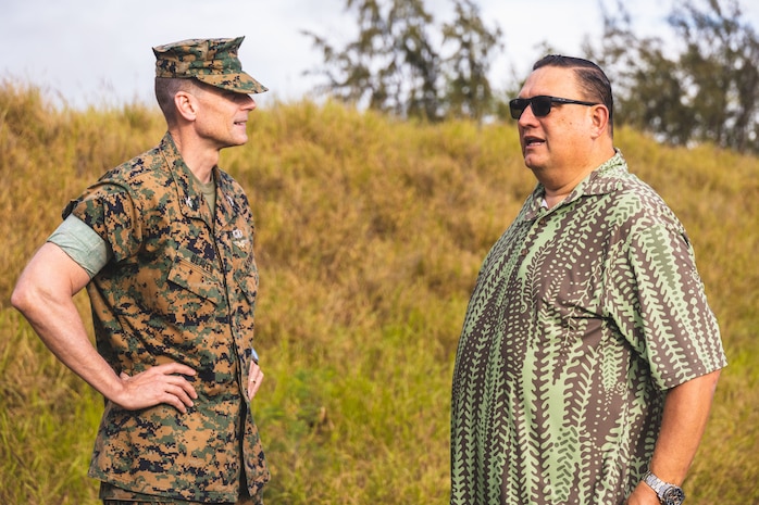 U.S. Marine Corps Col. Jeremy Beaven, left, commanding officer, Marine Corps Base Hawaii, meets with Sen. Kurt Favella, Hawaii State Senate District 20, while observing the collection of soil samples from the shoreline of the Pu’uloa Range Training Facility, HI, Feb. 15, 2024. The MCBH Environmental Compliance and Protection Division (ECPD) worked alongside the University of Hawaii, Brigham Young University - Hawaii, and Hawaii State Department of Health Hazard Evaluation and Emergency Response personnel to collect soil samples from across the 3,000-foot-long shoreline of the training facility that pose the greatest potential for off-site contaminant migration. (U.S. Marine Corps photo by Sgt. Brandon Aultman)