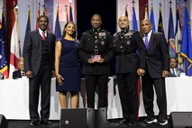 U.S. Marine Corps Lt. Gen. Brian W. Cavanaugh, Commander, Fleet Marine Force, Atlantic, Marine Forces Command, Commanding General, Marine Forces Northern Command, center right, stands with Brig. Gen. Ahmed Williamson, center, recipient of 2024 Stars and Stripes Honors award, at the 38th annual Becoming Everything You Are (BEYA) conference, Baltimore, Feb. 16, 2024. During the conference, Cavanaugh participated in mentoring sessions for STEM (science, technology, math, engineering) students and represented the Marine Corps to present the 2024 BEYA Stars and Stripes Honors award for outstanding leadership in STEM to Williamson, highlighting his role as the director of Manpower, Plans, and Policy Division at Manpower and Reserve Affairs: “His expertise was instrumental to developing the diversity, equity, and inclusion strategy for the Marine Corps, and his thoughtfulness helped leverage the talents of all Marines while capitalizing on innovation and adaptation to changing global circumstances.” Each year BEYA hosts over 2,500 college-bound K-12 students for three days of learning, networking, celebrating excellence, and showcasing STEM career opportunities. (U.S. Marine Corps photo by Casey Price)