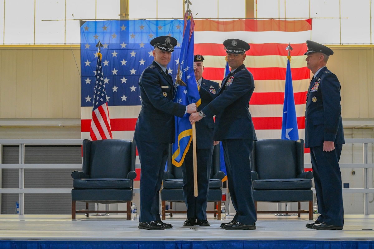 Air Force Chief of Staff Gen. David Allvin passes the Air Combat Command guidon to Gen. Ken Wilsbach.