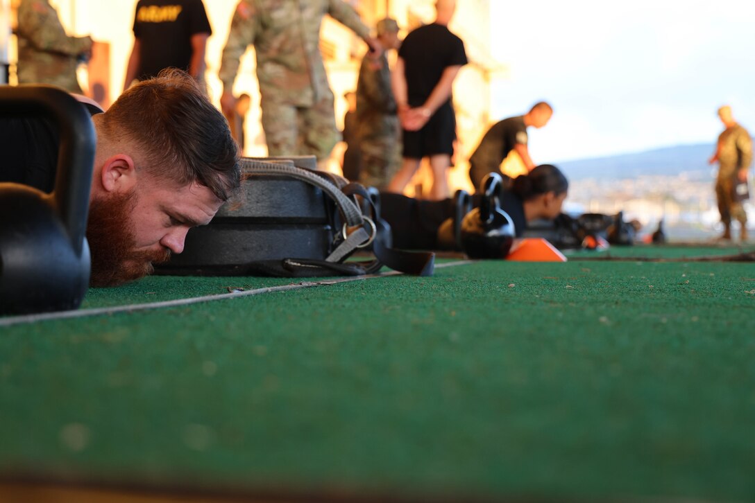 U.S. Army Soldiers get set for the sprint-drag-carry in the Army Combat Fitness Test during the U.S. Army Pacific Best Career Counselor Competition at John Rodgers Field, Hawaii, Feb. 26, 2024. Sixteen noncommissioned officers are competing, Feb. 26-29, 2024, with the top NCOs going on to compete at the Department of the Army level. (U.S. Army photo by Spc. Taylor Gray)