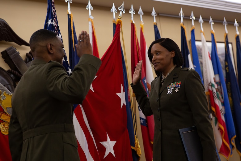 U.S. Marine Corps Brig. Gen. Ahmed T. Williamson, director of Operations for U.S. Cyber Command, administers the oath of office to U.S. Marine Corps Col. NaTasha M. Everly, a Department of State fellow, during a ceremony in Quantico, VA, March 1, 2024. Marine Corps officers are board-selected for promotion based on time in service, time in grade and performance. (U.S. Marine Corps photo by LCpl Anthony Ramsey)