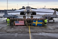 U.S. Air Force Airmen assigned to the 28th Bomb Wing, Ellsworth Air Force Base, South Dakota, pose for a group photo alongside Swedish military personnel in front of a B-1B Lancer and two Saab JAS 39 Gripens at Luleå-Kallax Air Base, Sweden, Feb. 26, 2024, during Bomber Task Force 24-2. These BTF missions are representative of the U.S.' extended deterrent commitment to its Allies and partners and enhance regional security. BTF operations provide U.S. leaders with strategic options to assure Allies and partners, while deterring potential adversary aggression across the globe. (U.S. Air Force photo by Staff Sgt. Jake Jacobsen)