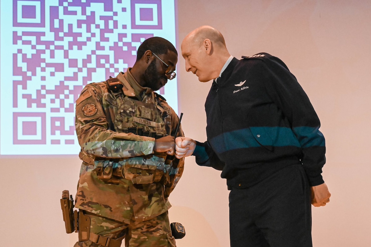 Air Force Chief of Staff Gen. David Allvin recognizes Airman 1st Class Ricardo Duncan, a defender.