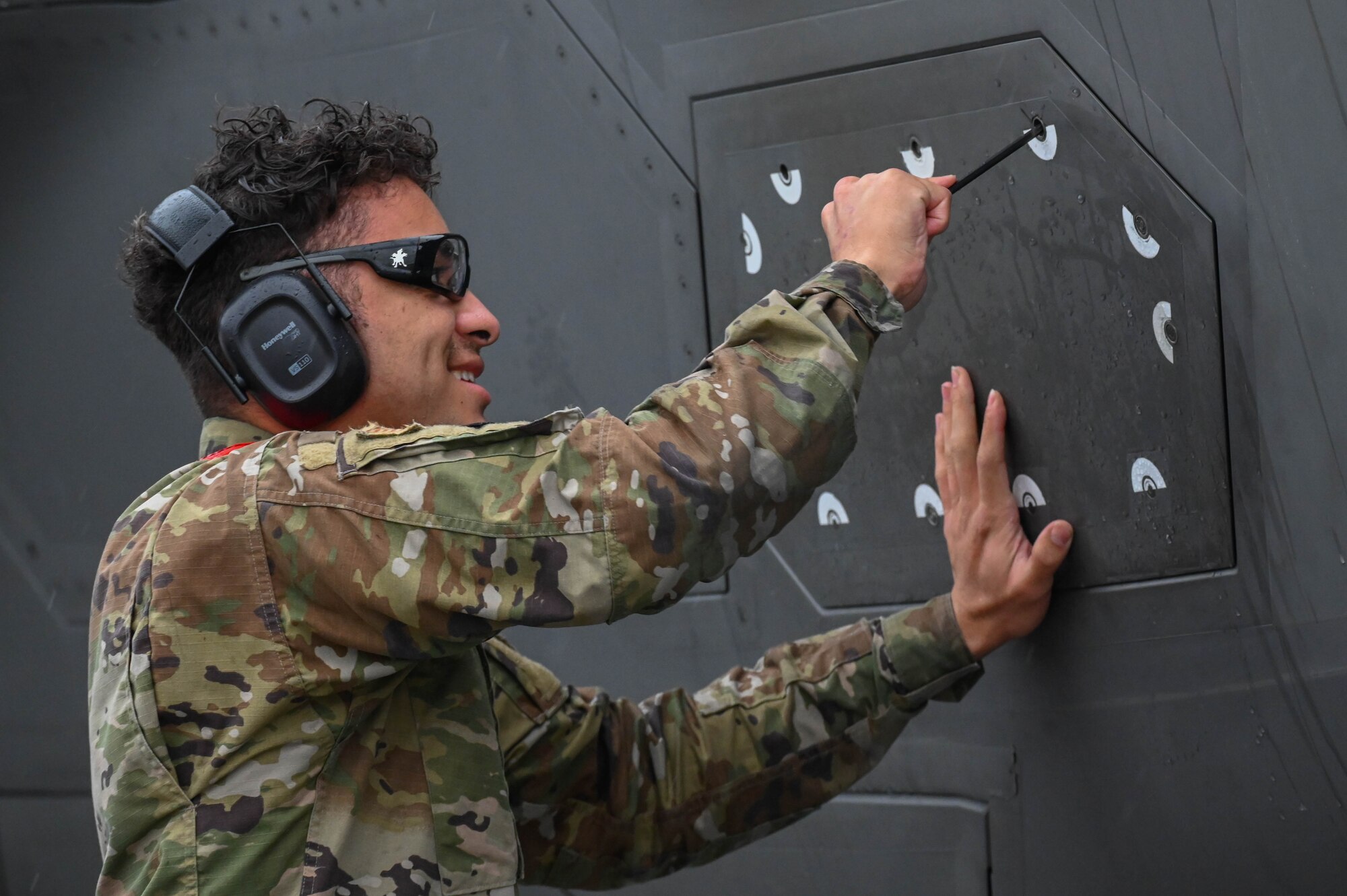 U.S. Air Force SrA Jordan Allende, 33rd Aircraft Maintenance Squadron weapons load crew member, secures F-35A Lightning II panel before takeoff at Savannah Air National Guard Base, Georgia, Feb. 12, 2024.