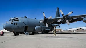 Airmen communicating with aircrew for departure.