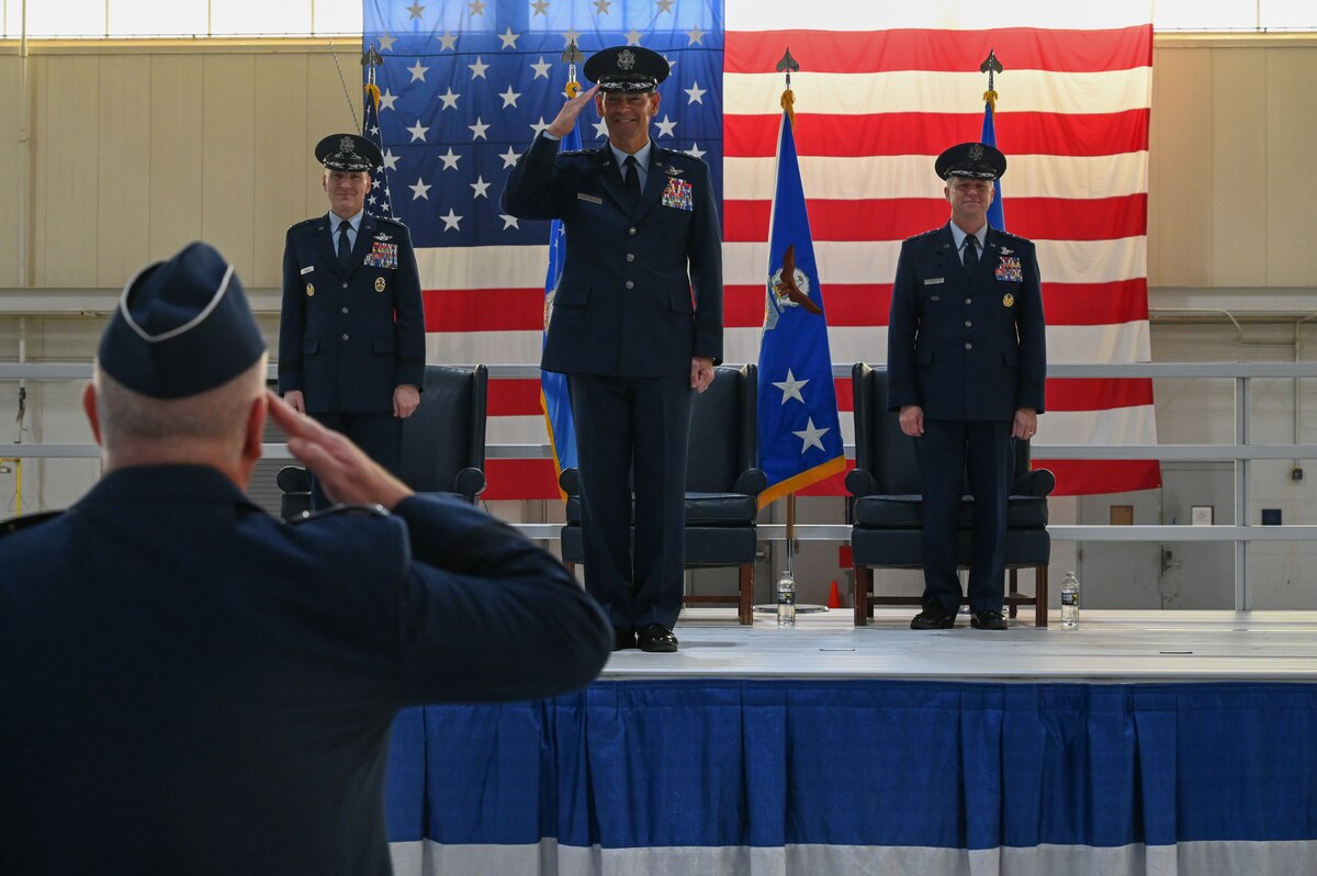 Lt. Gen. Michael Koscheski, deputy commander of Air Combat Command, renders the first salute to Gen. Ken Wilsbach, the new commander of ACC.