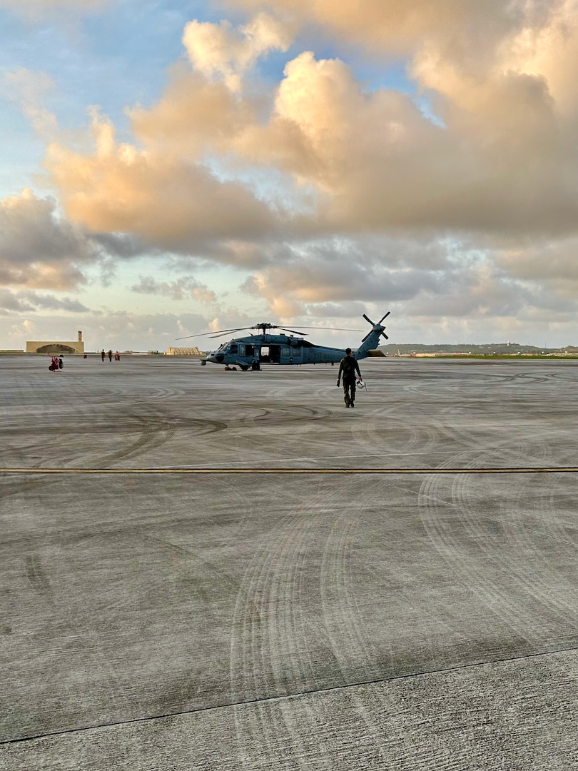 The crew of a U.S. Navy's Helicopter Sea Combat Squadron 25 (HSC-25) prepare to launch to medically evacuate a 26-year-old Filipino mariner from his vessel 100 nautical miles offshore to Guam on March 2, 2024. Responders initiated the operation after notification the mariner, aboard the 850-foot Liberian-flagged container ship Carmell 1, initially located 400 nautical miles northwest of Guam, exhibited severe abdominal issues. (U.S. Navy photo)