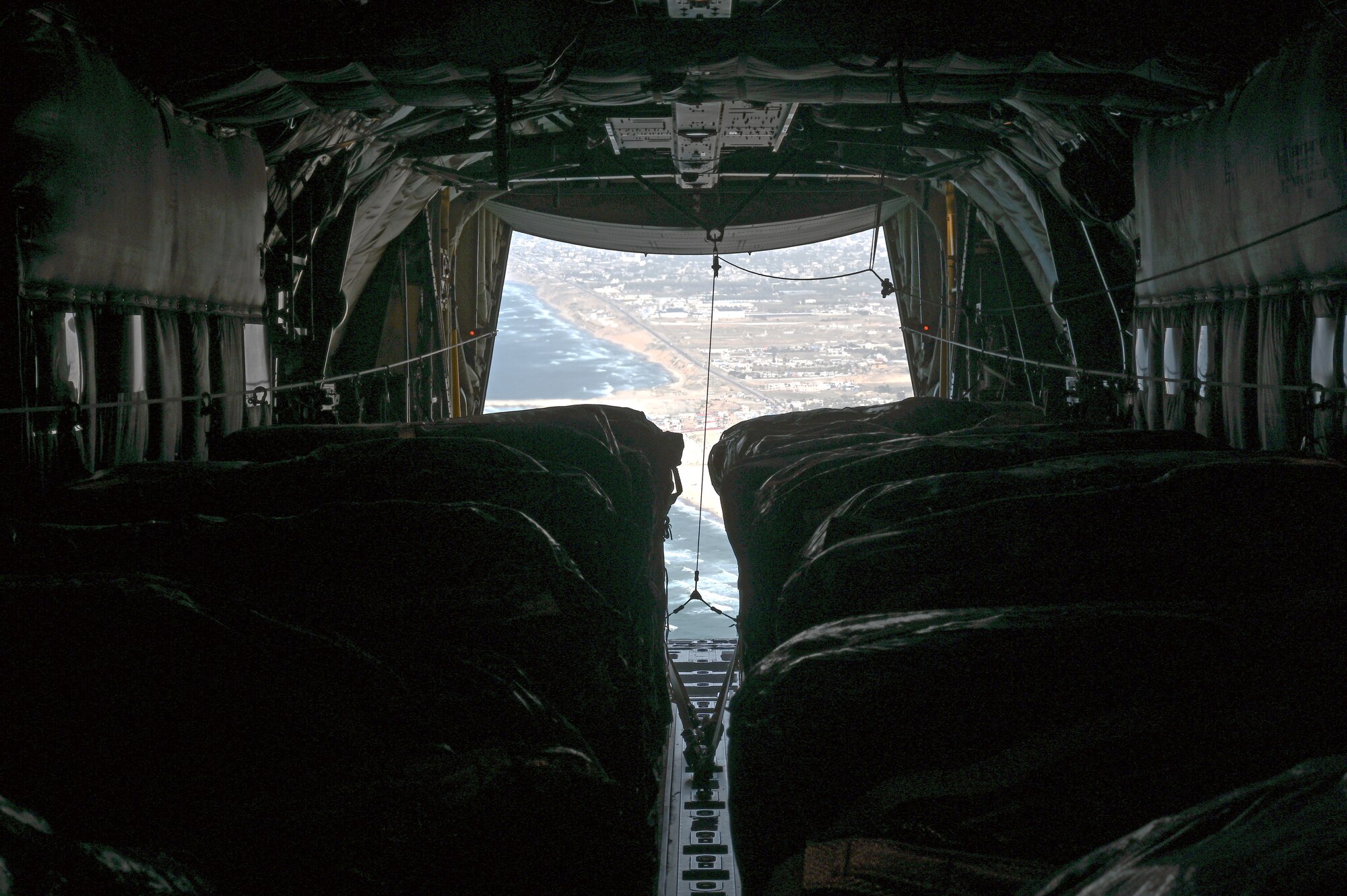 A C-130J airdrops 66 pallets of food over Gaza.
