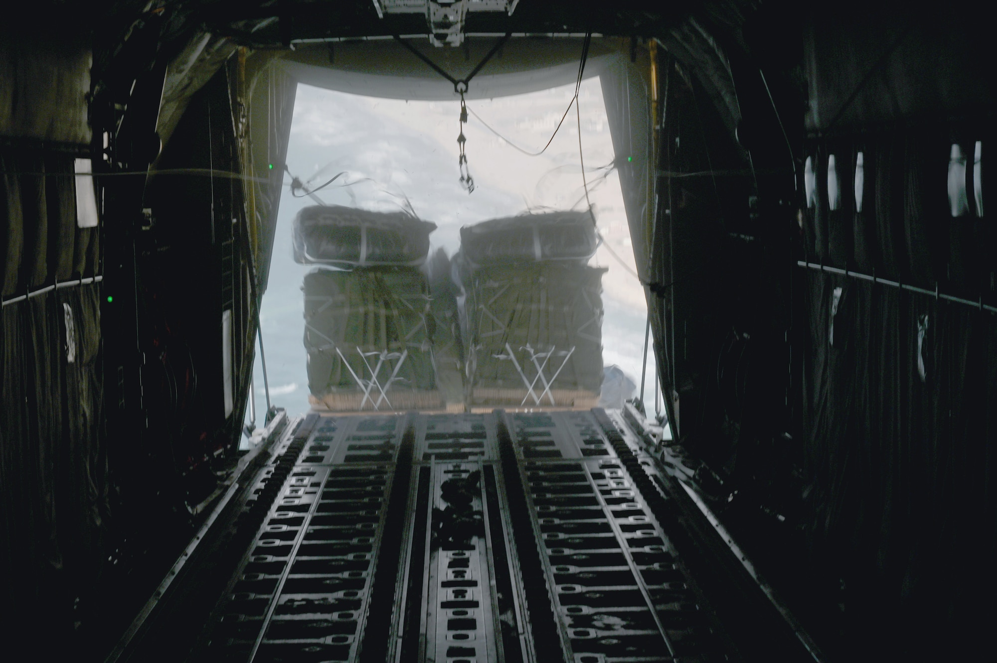 A C-130J airdrops 66 pallets of food over Gaza.