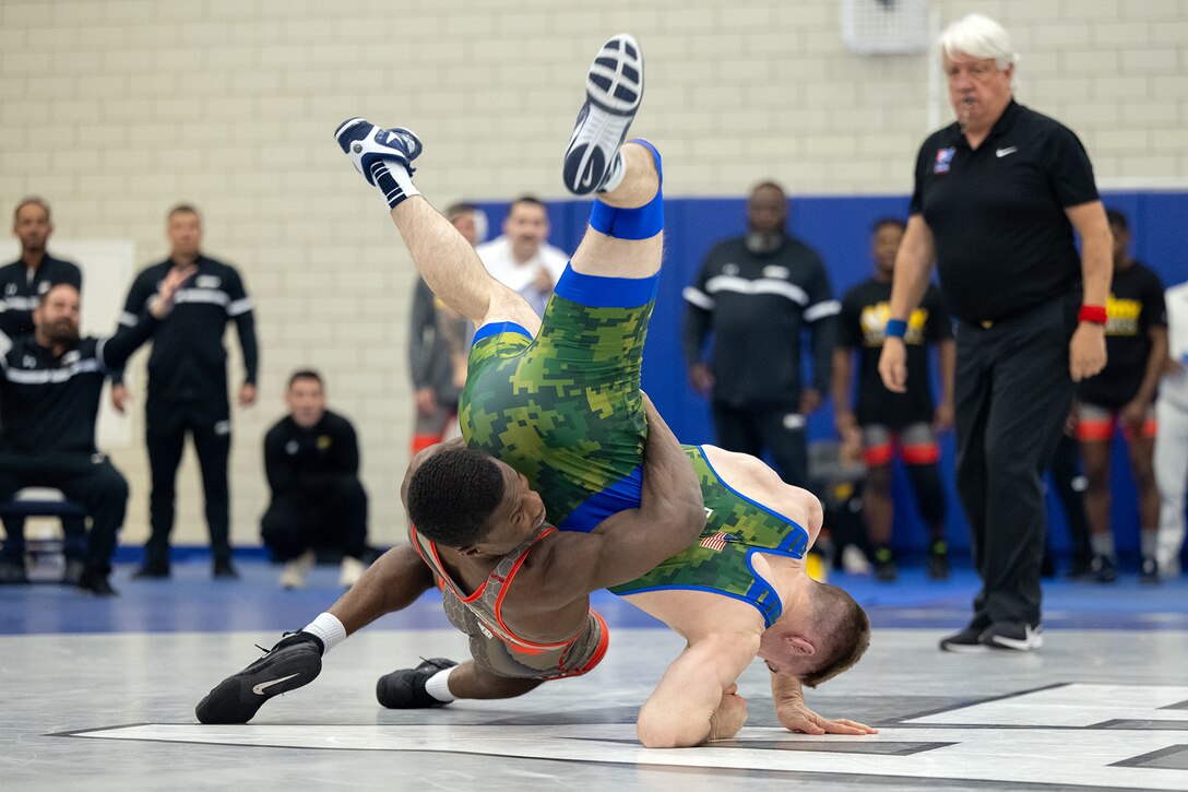 Army 2nd Lt. Peter Ogunsanya attempts to throw Air Force Capt. Brian Friery during the Greco-Roman style wrestling portion of  the 2024 Armed Forces Wrestling Championship at the U.S. Air Force Academy in Colorado Springs, Colo. March 2, 2024. (DoD photo by EJ Hersom)