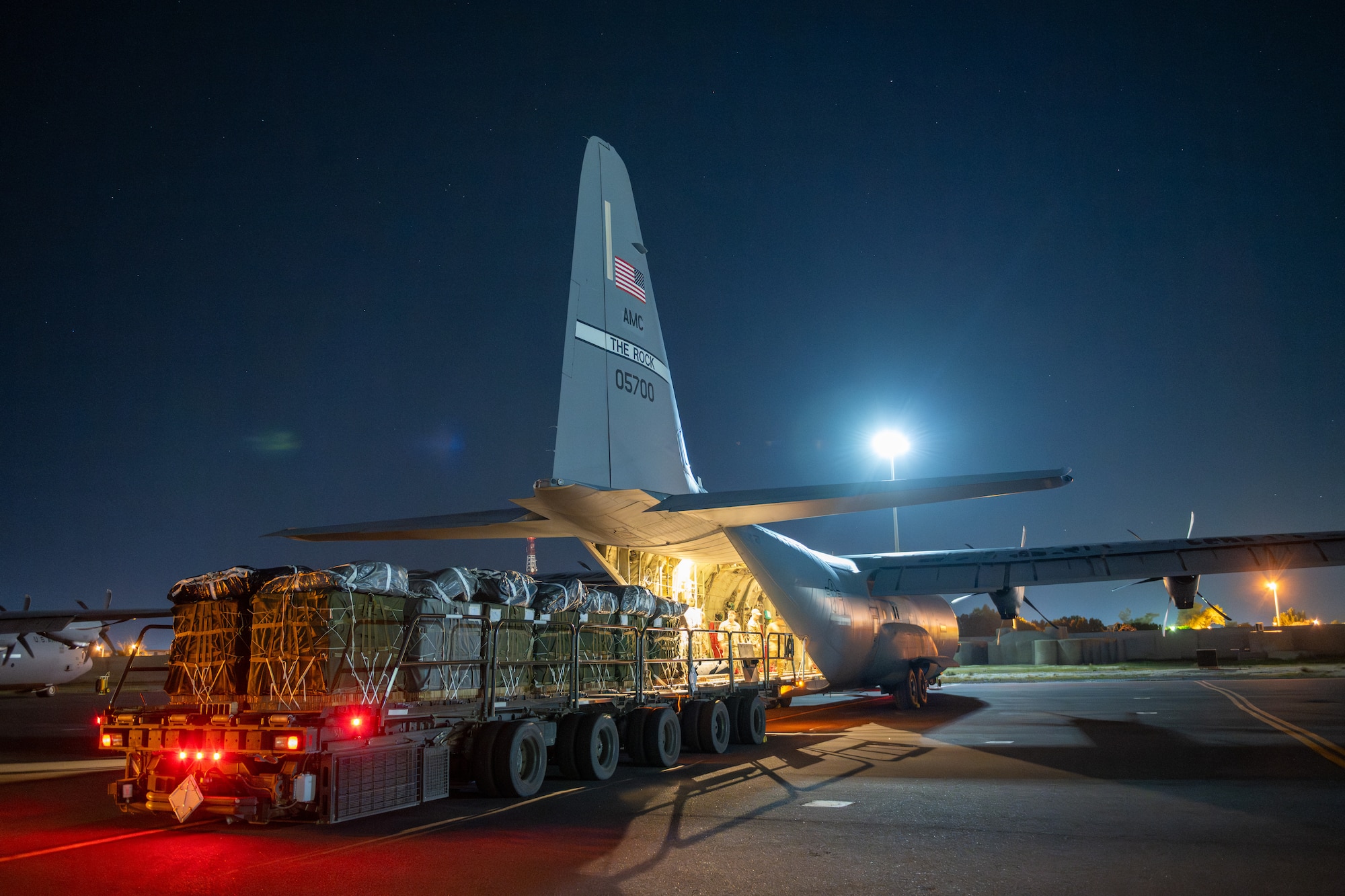 Over 38,000 Meals Ready to Eat and water destined for an airdrop over Gaza are loaded aboard a U.S. Air Force C-130J Super Hercules at an undisclosed location in Southwest Asia.