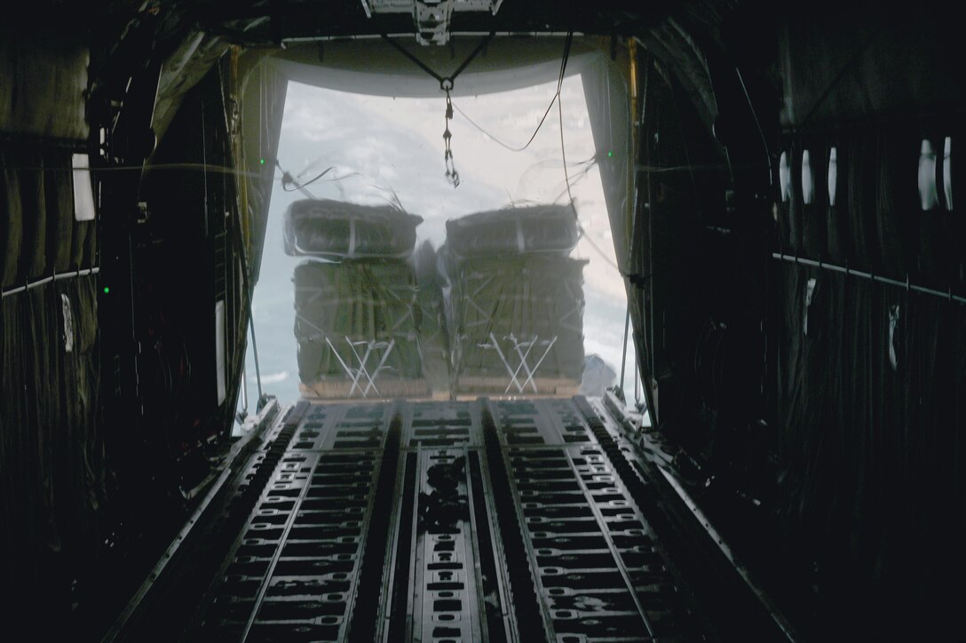 A C-130J airdrops 66 pallets of food over Gaza.