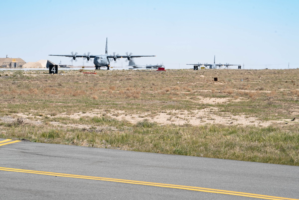 Three C-130J Super Hercules loaded with humanitarian aid bound for airdrop over Gaza take off from an undisclosed location in Southwest Asia.