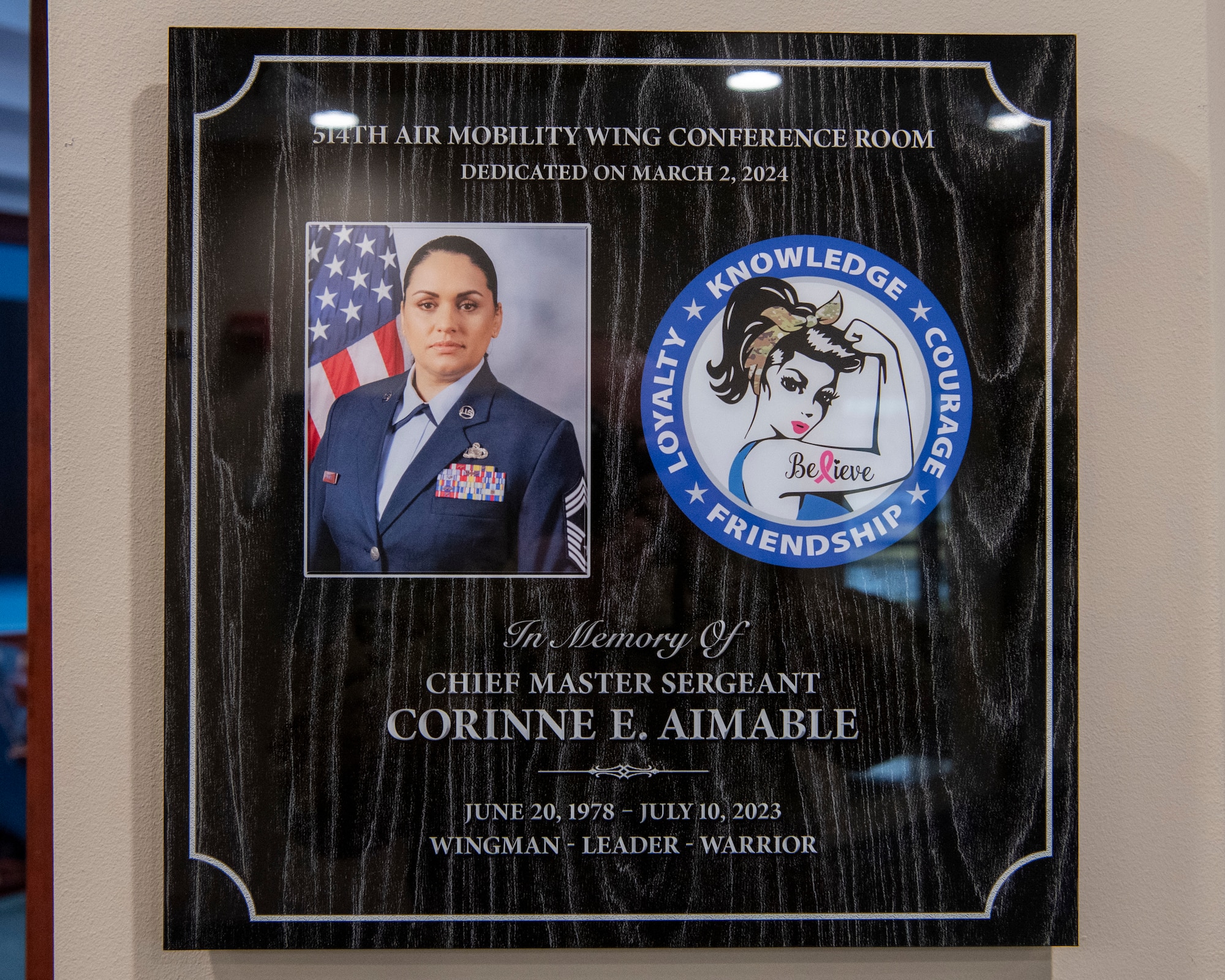 The 514th Air Mobility Wing unveiled a plaque dedication for Chief Master Sgt. Corinne E. Aimable at the 514th AMW Wing headquarters at Joint Base McGuire-Dix-Lakehurst, New Jersey, March 2, 2024. In attendance at the plaque dedication were members of the Aimable family and many Airmen who consider themselves blessed to have had the chief as a mentor and as a friend. Aimable was laid to rest on July 18, 2023, after a two-year battle with cancer.